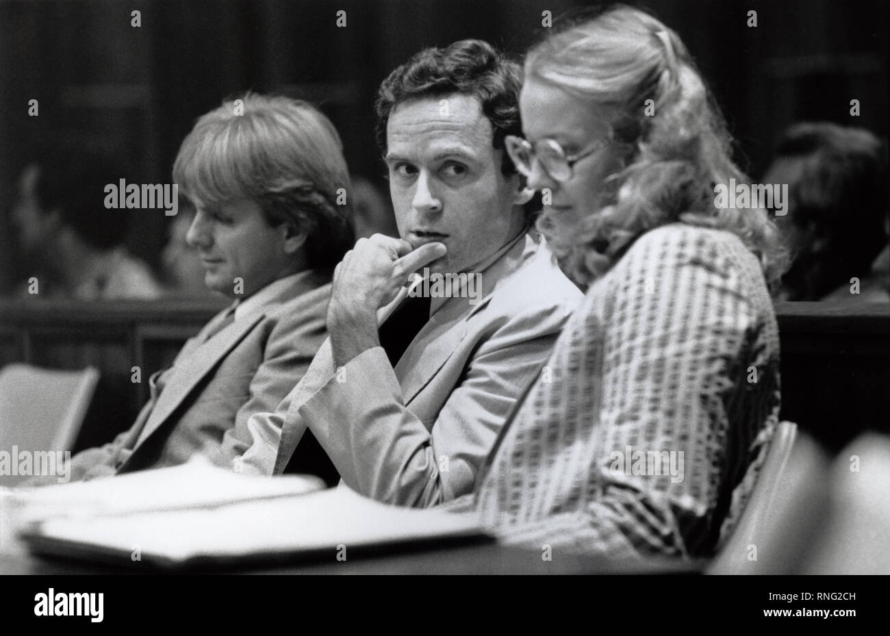 Ted Bundy Murder Trial - Miami - Ted Bundy with defense attorney Margaret Good at the defense table. Theodore Robert Bundy was an American serial killer, kidnapper, rapist, burglar, and necrophile who assaulted and murdered numerous young women and girls during the 1970s and possibly earlier. After more than a decade of denials, he confessed to 30 homicides that he committed in seven states between 1974 and 1978. Stock Photo