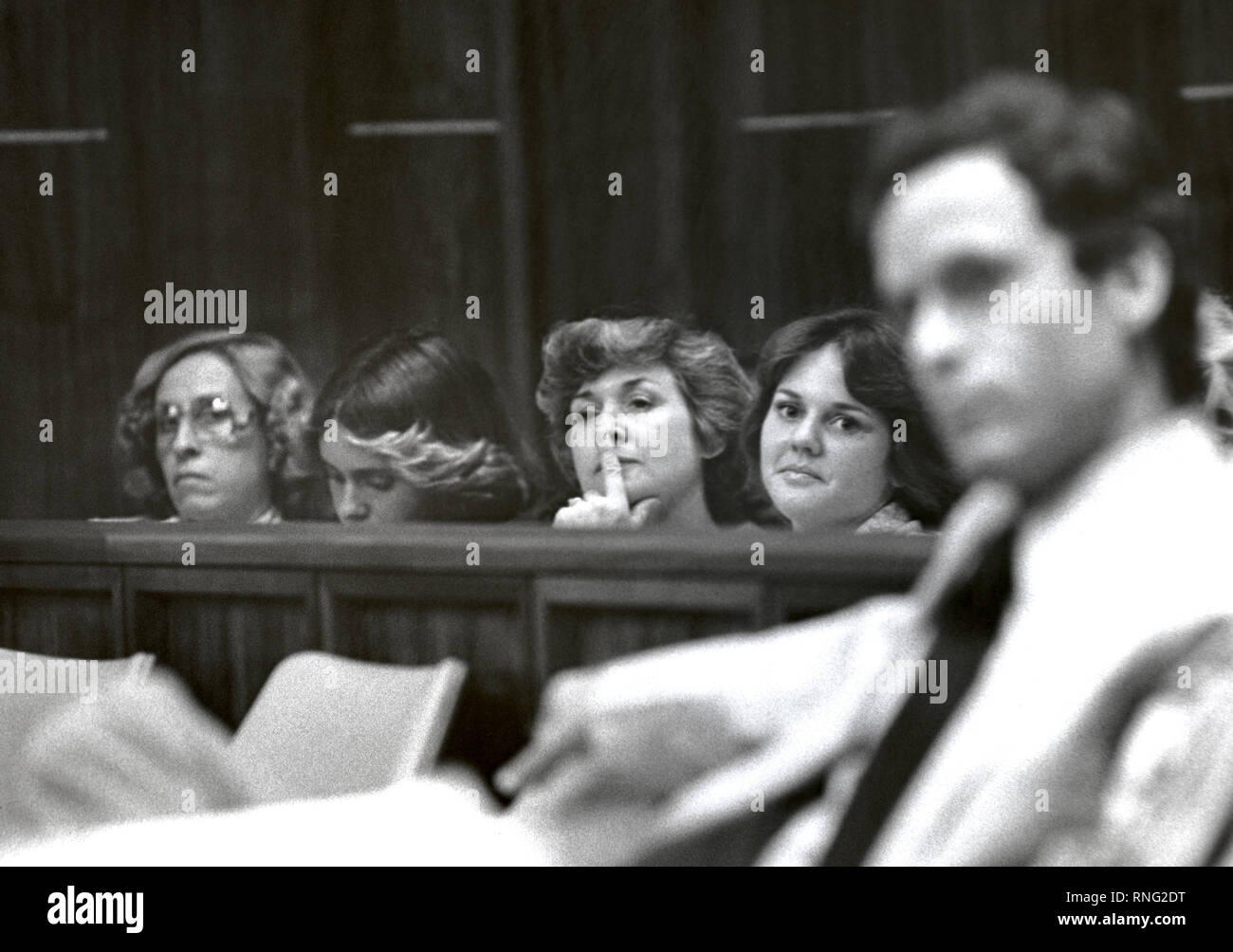 Ted Bundy Murder Trial - Miami - Scores of young women arrive at the courthouse early each morning trying to be admitted to the Ted Bundy Trial and if luck would have it - the front row of the courtroom behind Bundy. Some accounts referred to some of the women as Bundy's Groupies. Theodore Robert Bundy was an American serial killer, kidnapper, rapist, burglar, and necrophile who assaulted and murdered numerous young women and girls during the 1970s and possibly earlier. After more than a decade of denials, he confessed to 30 homicides that he committed in seven states between 1974 and 1978. Stock Photo