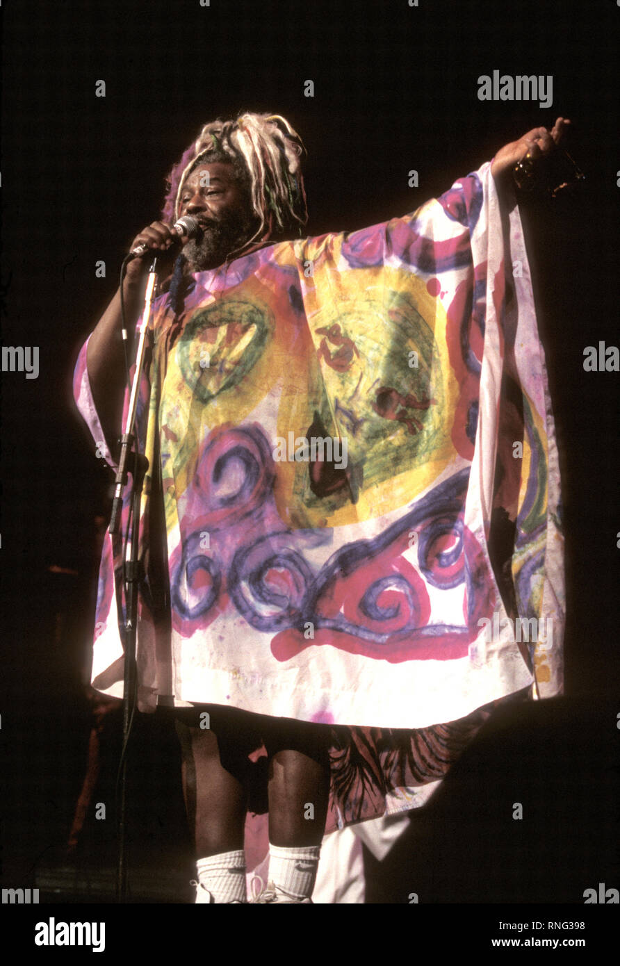 Musician, principal architect and mastermind of the bands Parliament and Funkadelic, George Clinton is shown performing onstage during Woodstock '99. Stock Photo