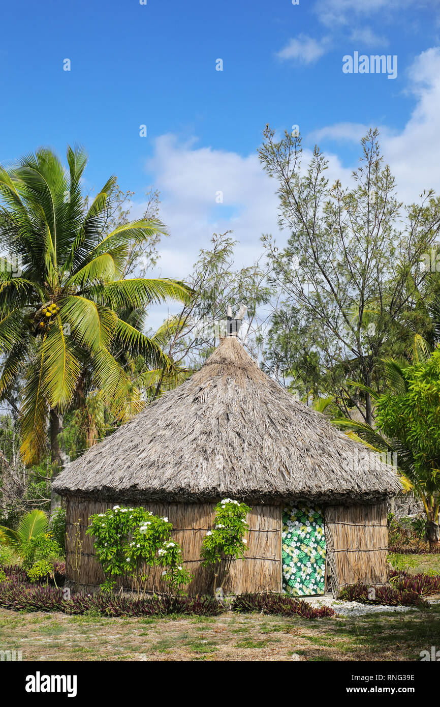 Traditional Kanak house on Ouvea Island,  Loyalty Islands, New Caledonia. Kanak are the indigenous Melanesian inhabitants of New Caledonia. Stock Photo