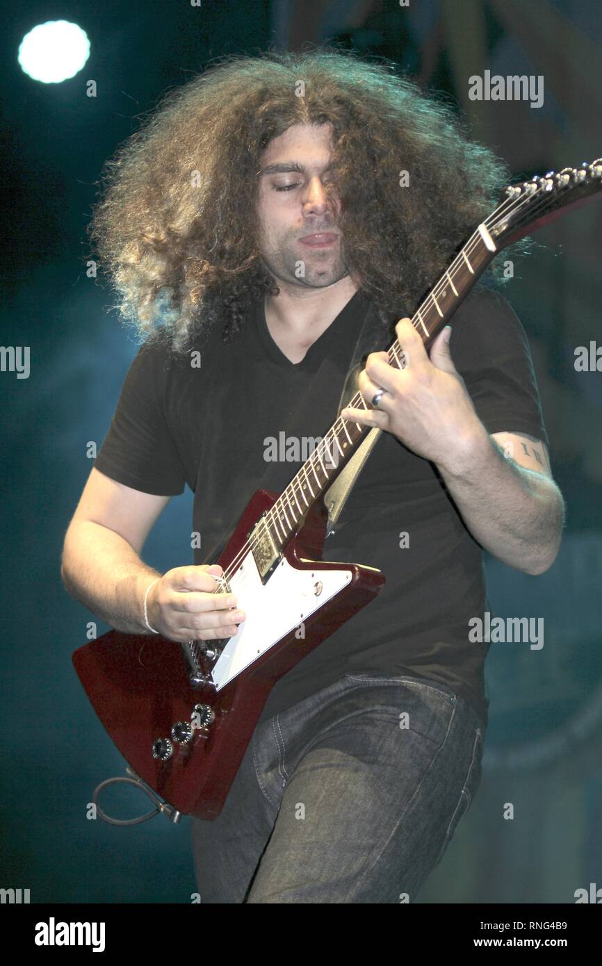 Singer, songwriter and guitarist Claudio Sanchez is shown performing on stage during a 'live' concert appearance with Coheed and Cambria. Stock Photo