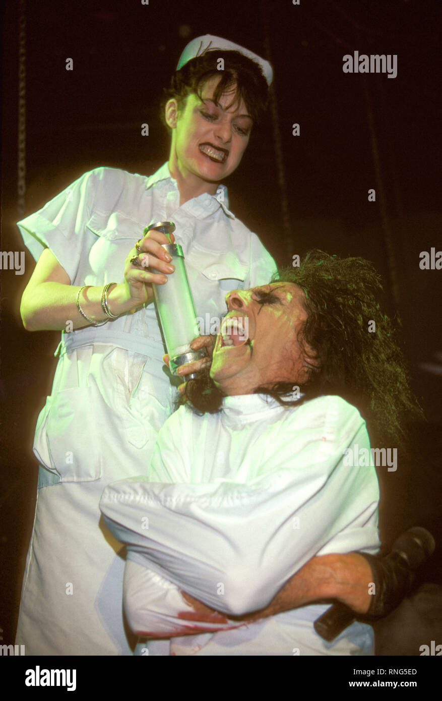Singer and songwriter Alice Cooper (born Vincent Damon Furnier) is shown on stage during a "live