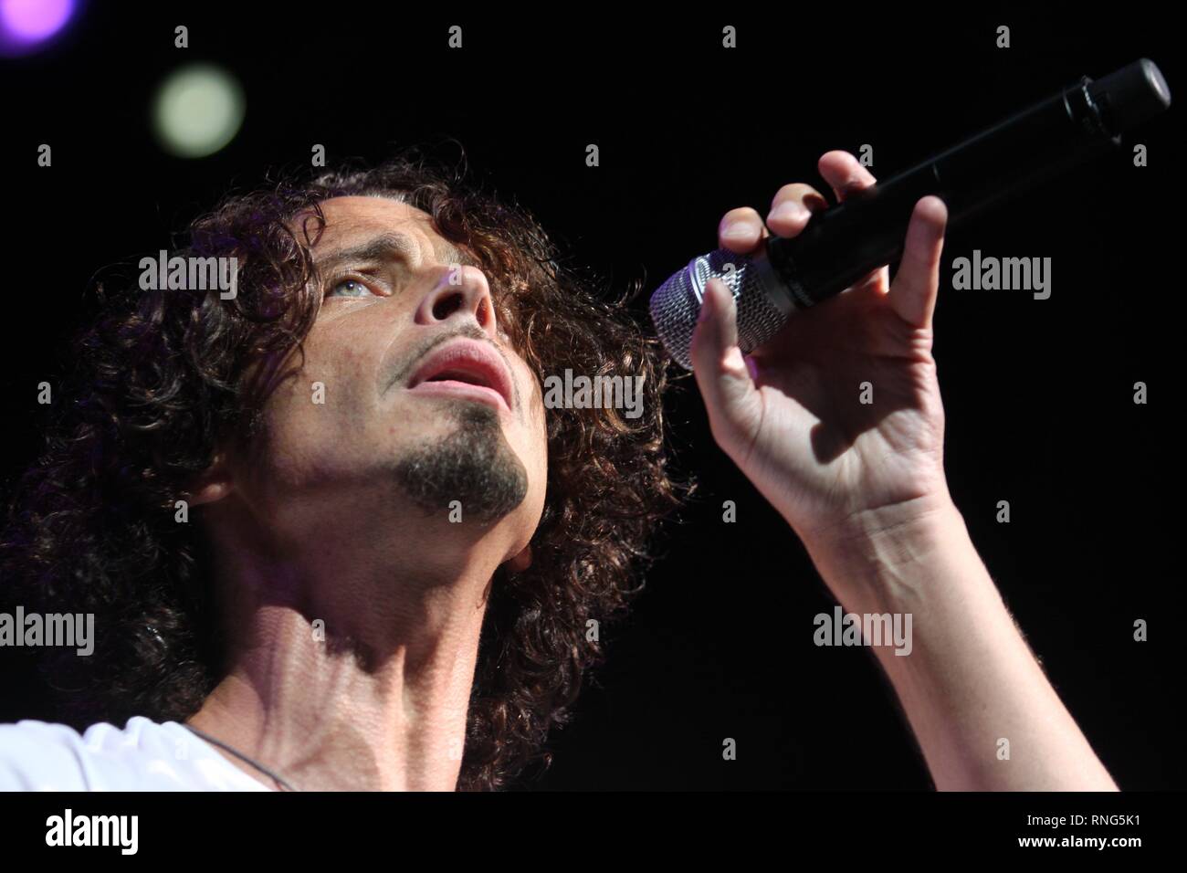 Rock musician best known as the lead singer and songwriter for rock bands Soundgarden and Audioslave, Chris Cornell, is shown performing on stage during a 'live' concert appearance. Stock Photo