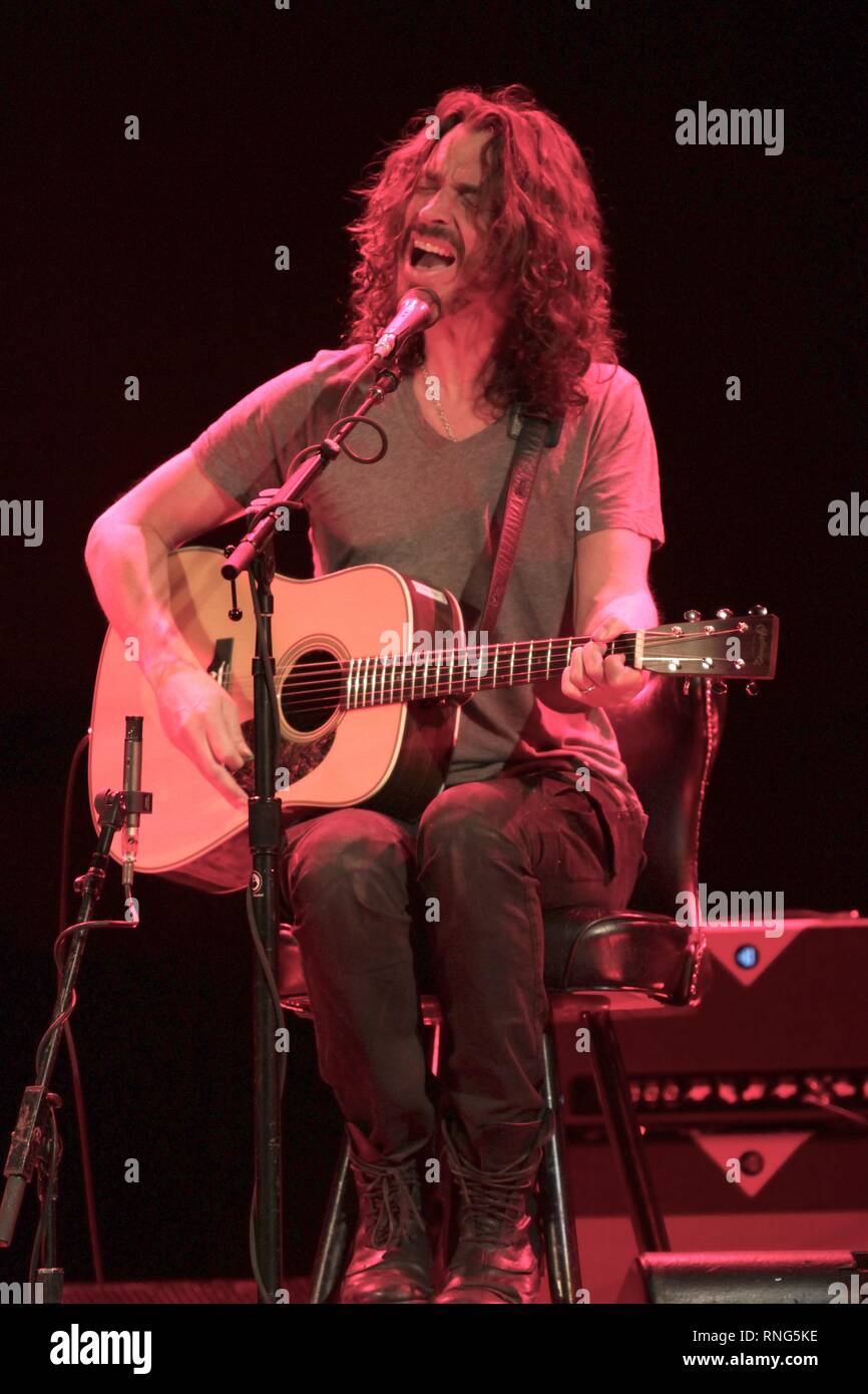 Musicin Chris Cornell is shown performing on stage during solo acoustic concert appearance. Stock Photo