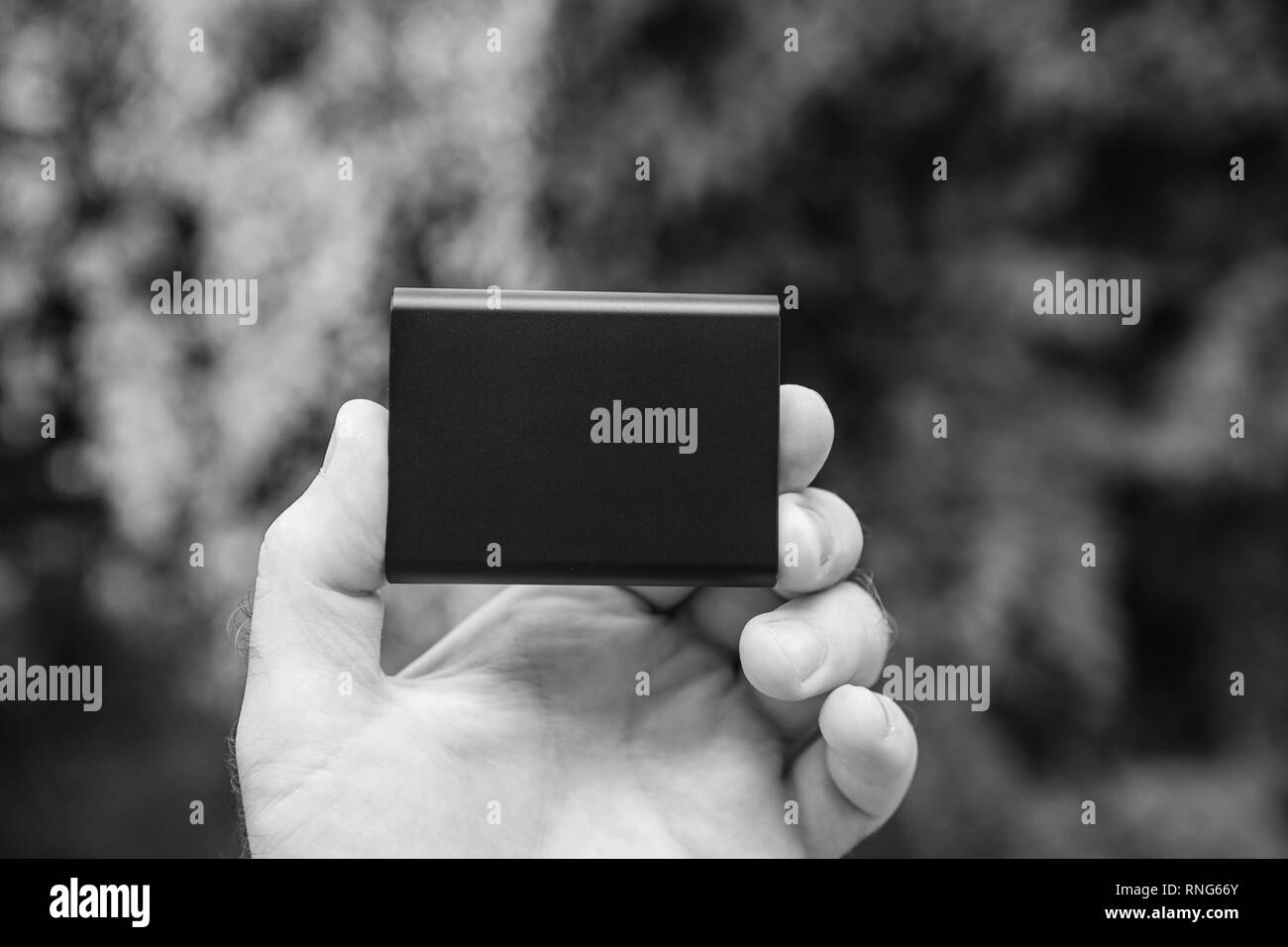 Man hand holding portable external hard drive disk with high read and