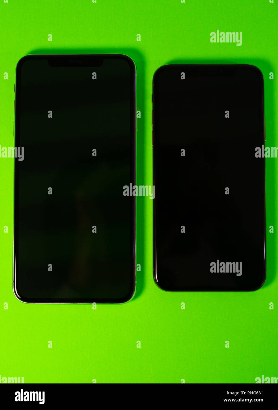 PARIS, FRANCE SEP 27, 2018 Two Apple Computers iPhone Xs and Xs Max as hero object on bright