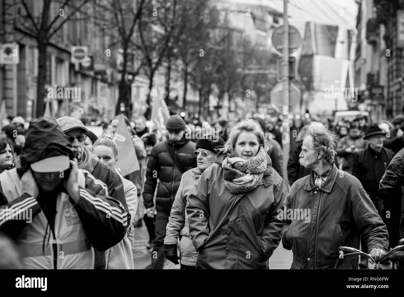 STRASBOURG, FRANCE - MAR 22, 2018: CGT General Confederation of Labour workers with placard at demonstration protest against Macron French government string of reforms - adults and seniors discussing the protest - black and white Stock Photo