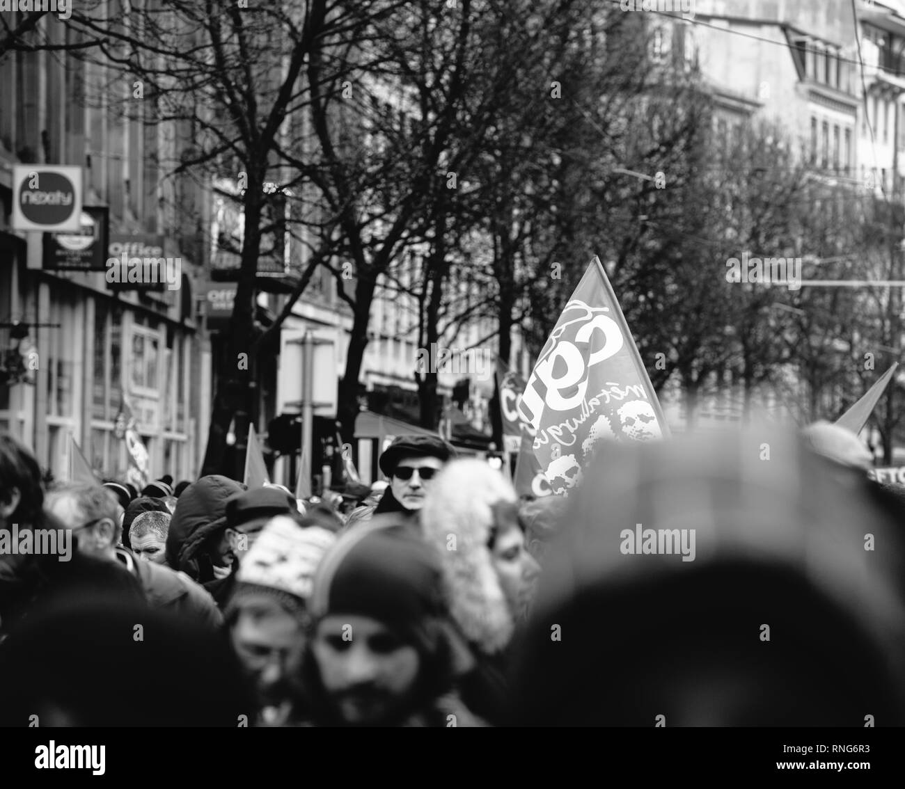 STRASBOURG, FRANCE - MAR 22, 2018: CGT General Confederation of Labour workers with placard at demonstration protest against Macron French government string of reforms - black and white image of protesters on street Stock Photo
