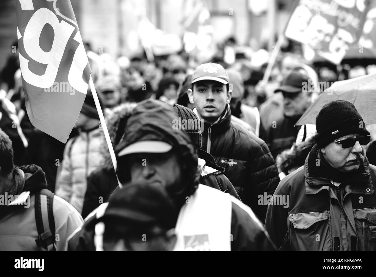 STRASBOURG, FRANCE - MAR 22, 2018: CGT General Confederation of Labour workers with placard at demonstration protest against Macron French government string of reforms - black and white people marching Stock Photo
