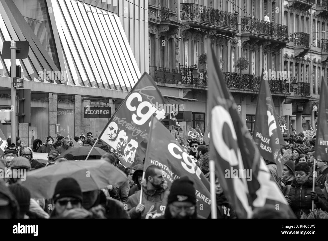 STRASBOURG, FRANCE - MAR 22, 2018: CGT General Confederation of Labour workers with placard at demonstration protest against Macron French government string of reforms - closed central street people with flags Stock Photo