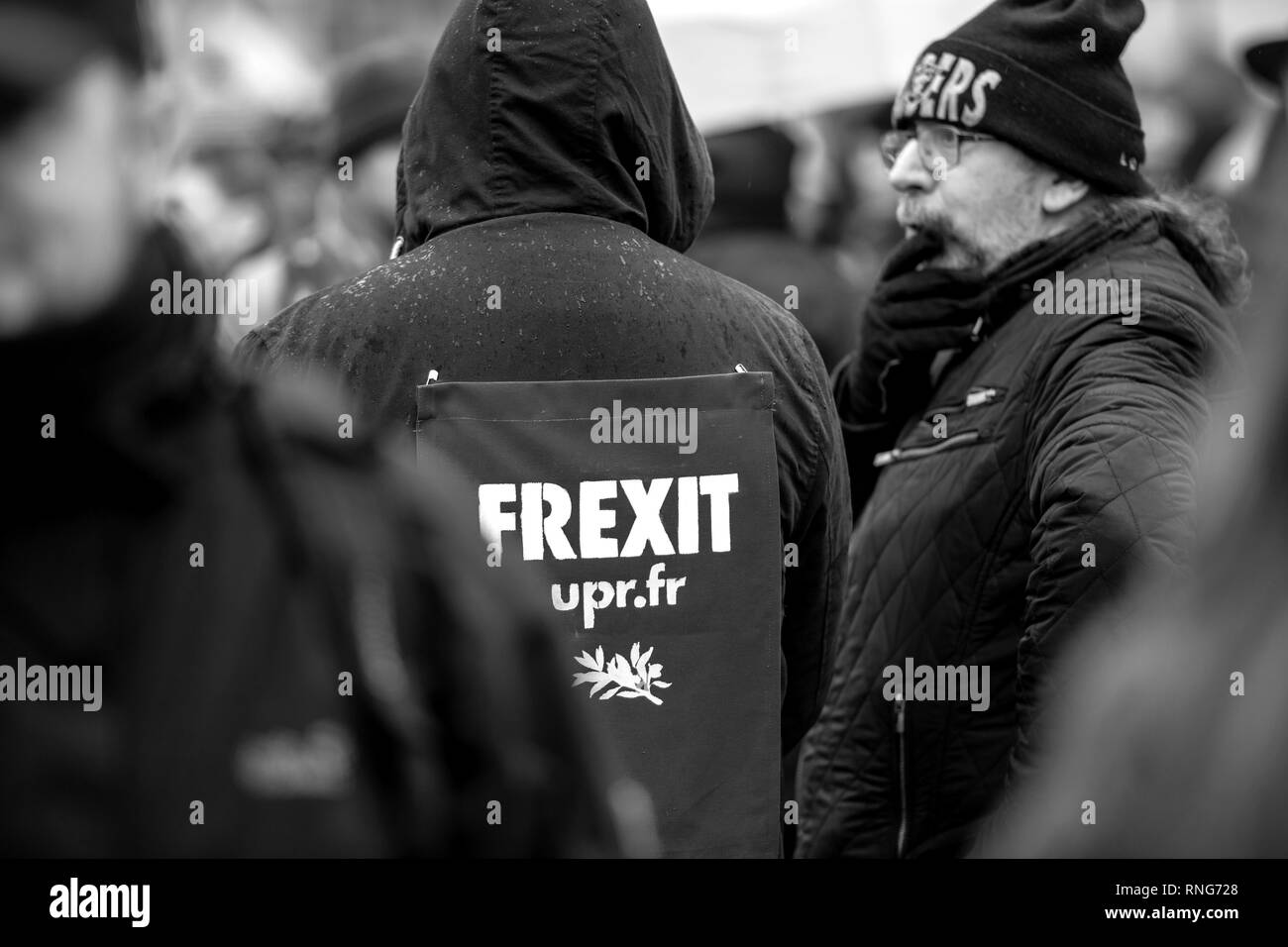 STRASBOURG, FRANCE - MAR 22, 2018: People gathering in Place Kleber square during CGT General Confederation of Labour demonstration protest against Macron French government string of reforms - man with Frexit sign on back of his jacket Stock Photo