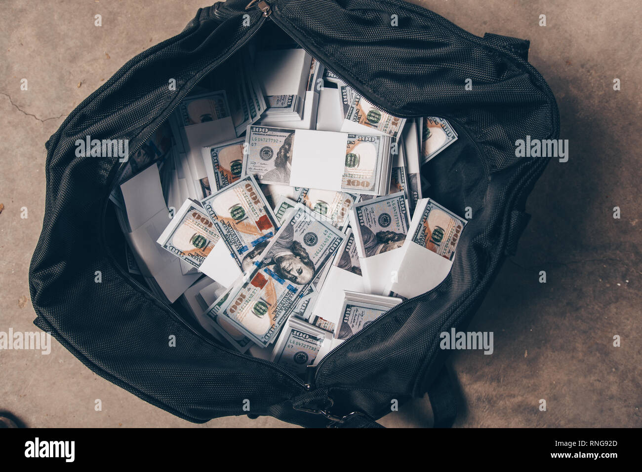 Image Of Big Bag Full Of American Dollars On The Floor Stock Photo