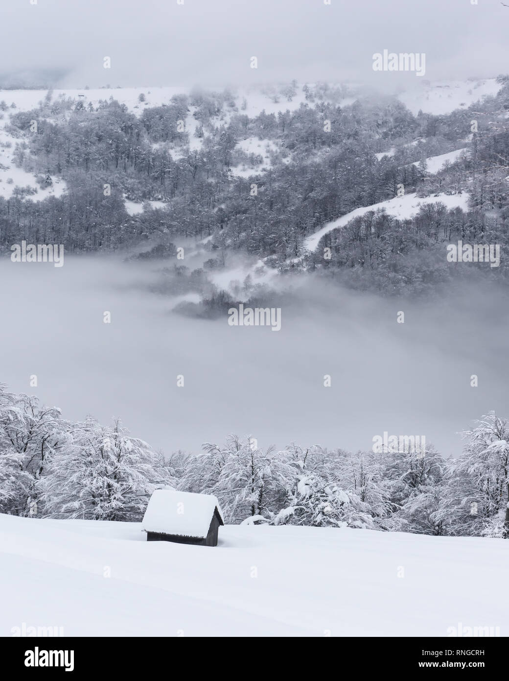 Fantastic winter landscape with wooden house in snowy mountains ...