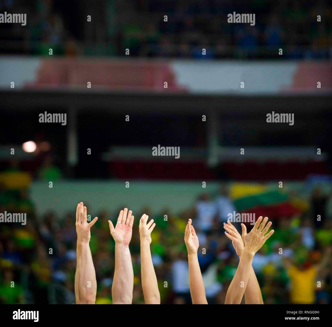 fans clapping on the podium of the stadium Stock Photo