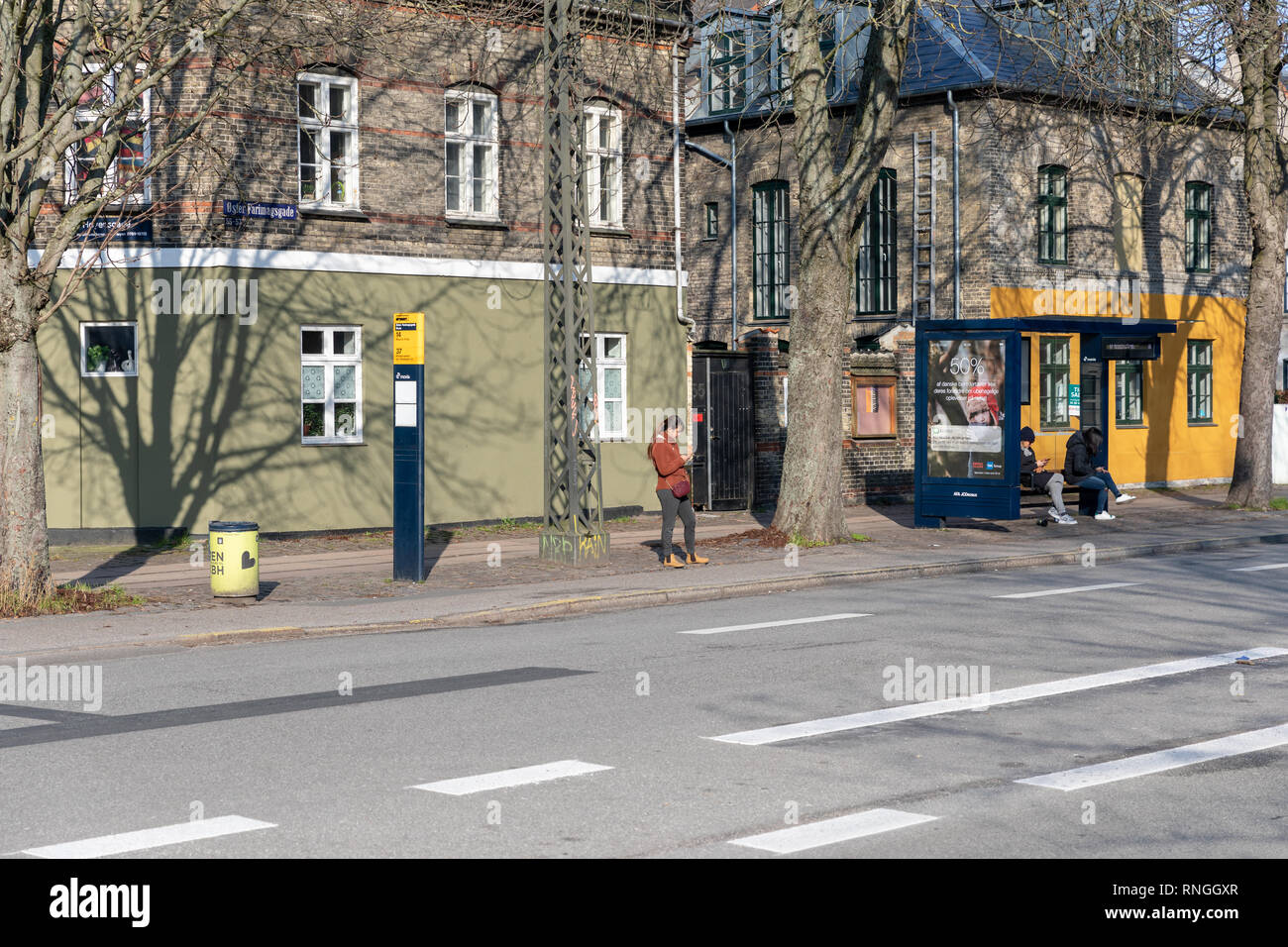 People at a bus stop, Øster Farimagsgade, Copenhagen, Denmark Stock Photo