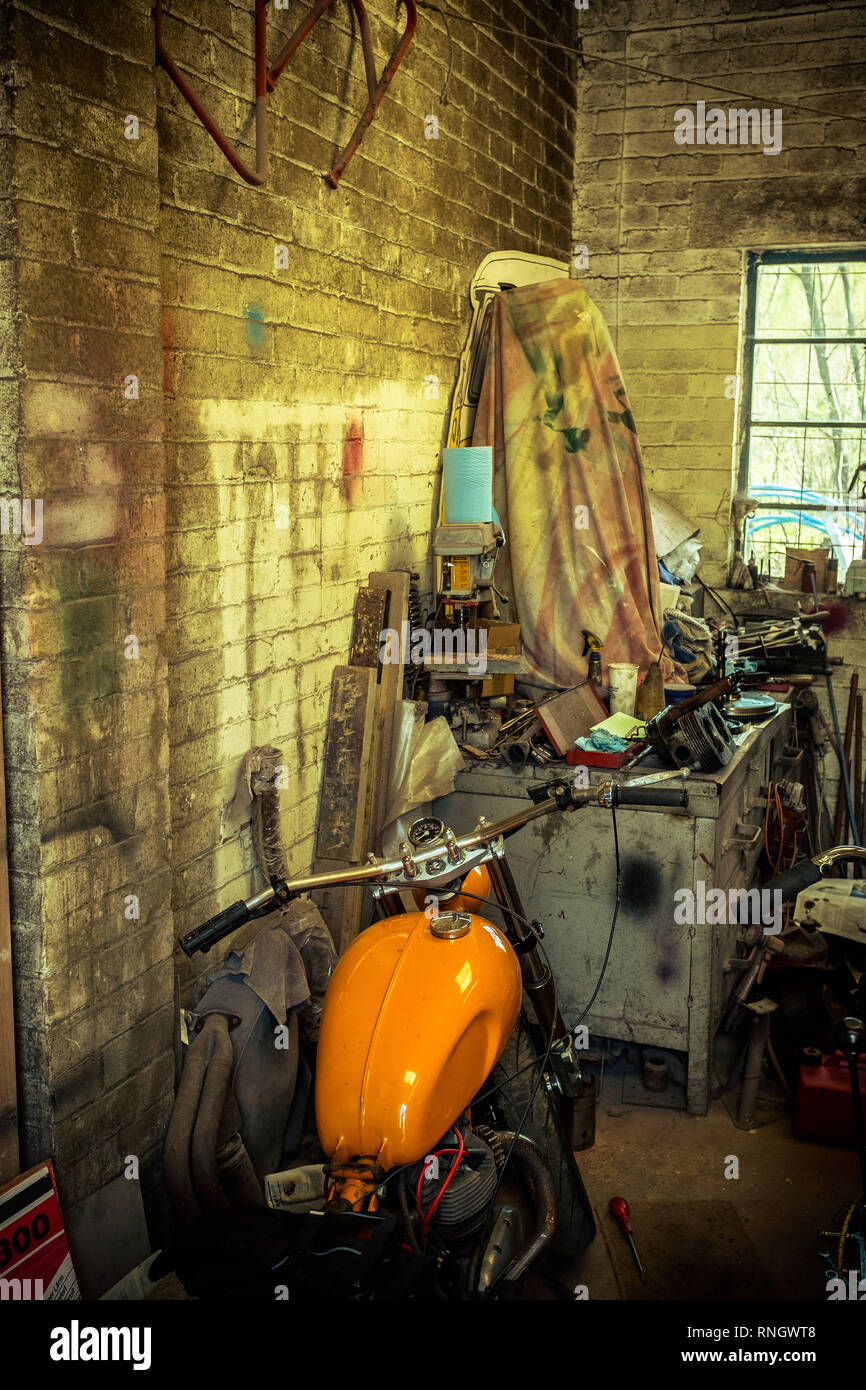 Interior view of local motorcycle garage full of various