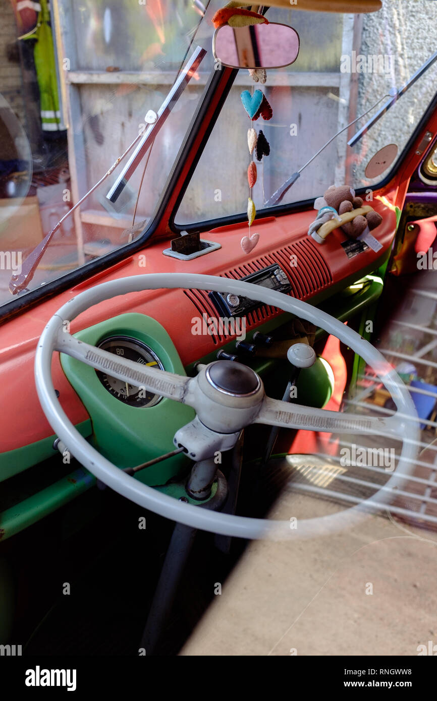 Looking through side window into split screen vw camper van with basic ...