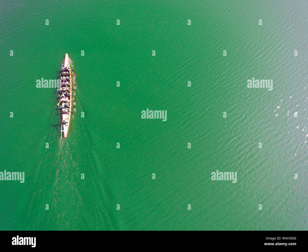 Aerial view of rowing team on water Stock Photo