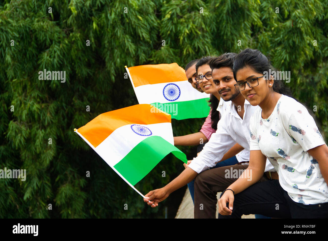 PUNE, MAHARASHTRA, INDIA, 15 Aug 2018, Group of young boys and girls posing with Indian Flag on the occasion of Independence Day Stock Photo