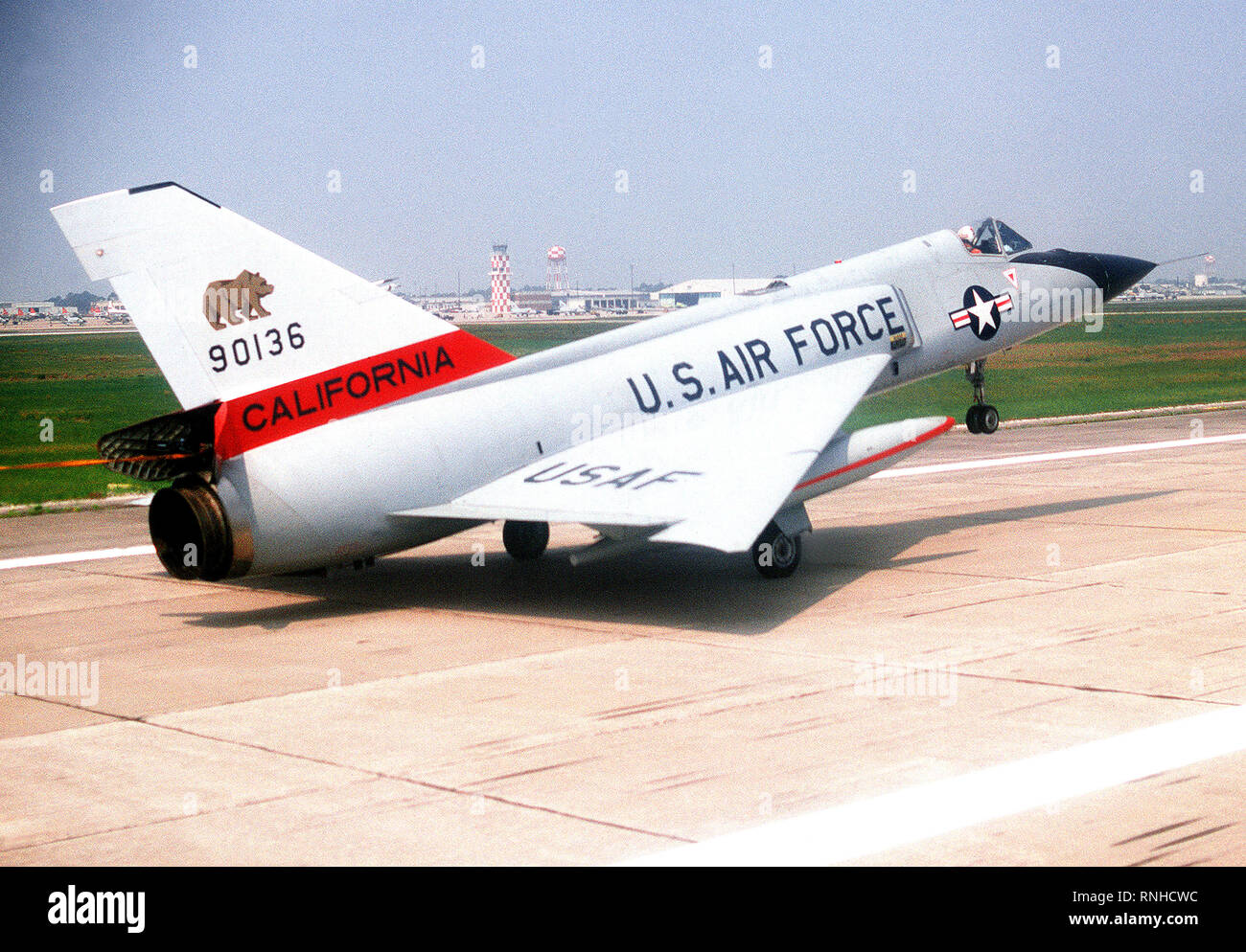 1980-a-right-rear-view-of-an-f-106-delta-dart-aircraft-landing-after-a-training-mission-an-auxiliary-fuel-tank-is-on-each-wing-the-aircraft-is-assigned-to-the-194th-fighter-interceptor-squadron-california-air-national-guard-RNHCWC.jpg