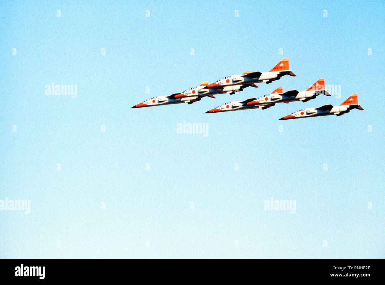 1981 - A left side view of six T-2 Mitsubishi jet trainer aircraft flying in formation during an air show.  Within the next year, the T-2 aircraft will replace the F-86F Sabre aircraft that are presently flown by the Japanese Blue Impulse Precision Flying Team. Stock Photo