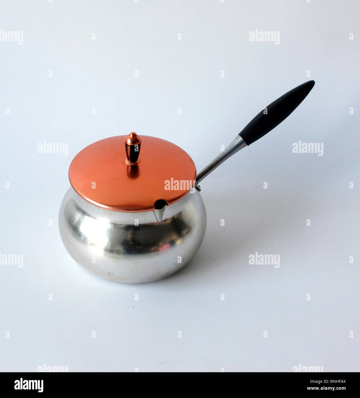 Vintage dairy milk anodized aluminum with lid. Silver and copper colors Brand MMM, Manufacturas Metálicas Madrileñas, Made in Spain Stock Photo