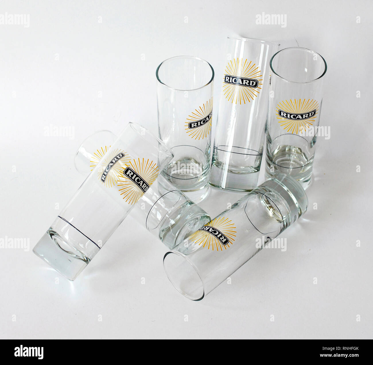 Set of six tube glasses, advertising by Ricard, France. Glass with the logo  of the sun and a line to indicate the measure of liquor Stock Photo - Alamy