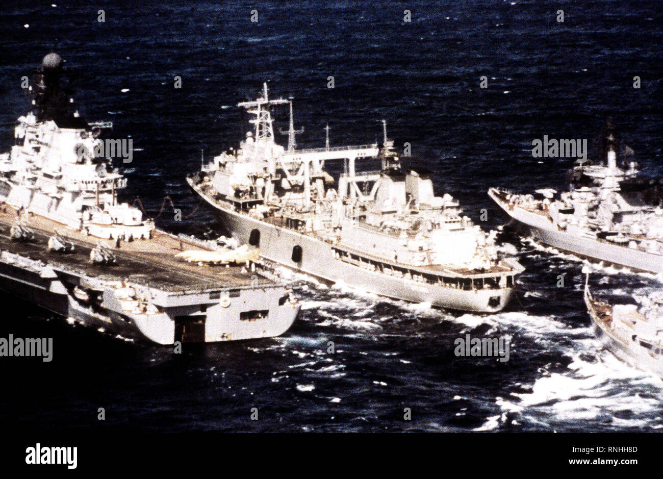 1982 - A port quarter view of the Soviet Keila class transport ship BEREZINA, center, replenishing three warships while underway. Stock Photo