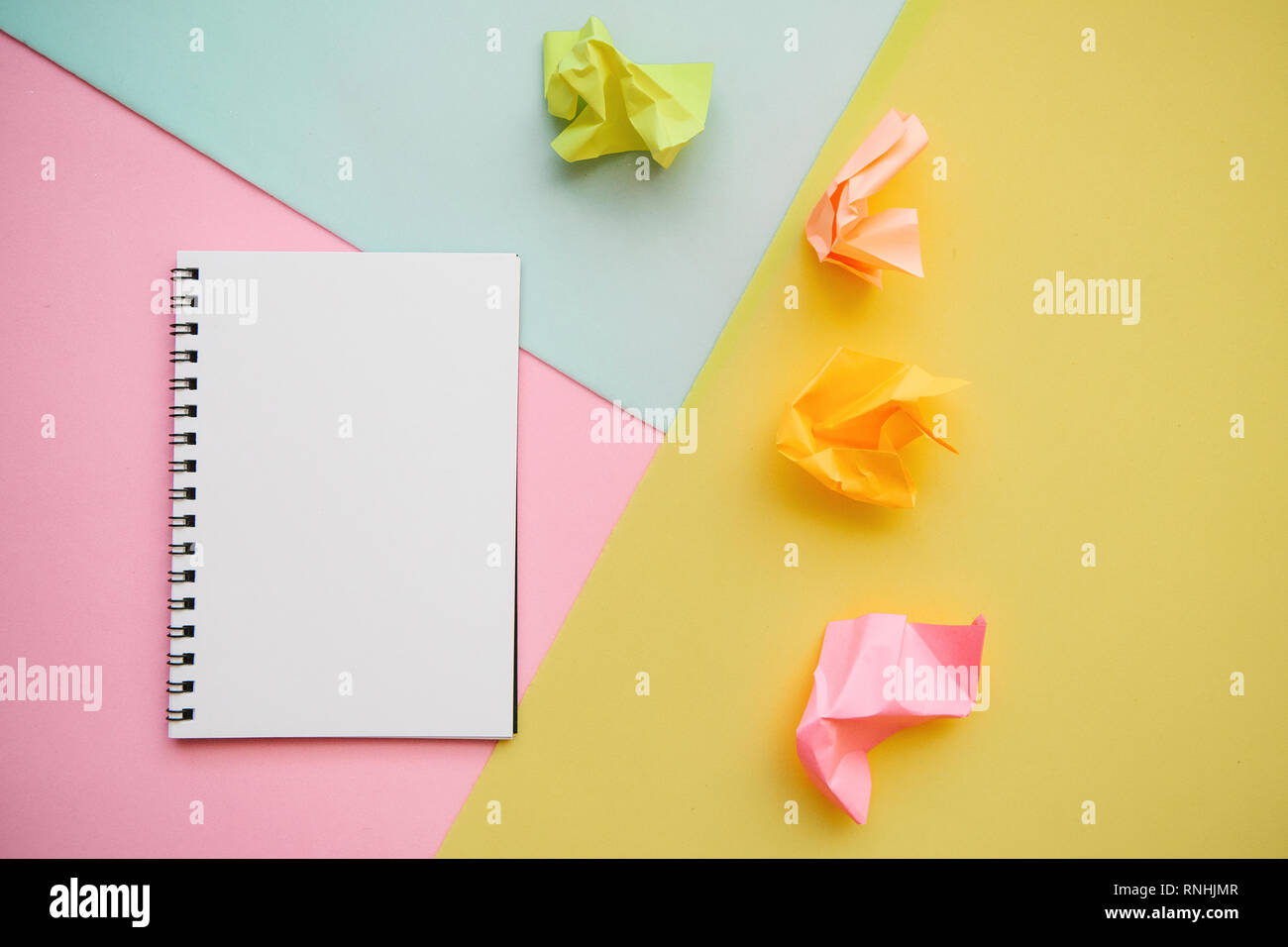 Blank notepad with place for text on a multi-colored background. Stock Photo
