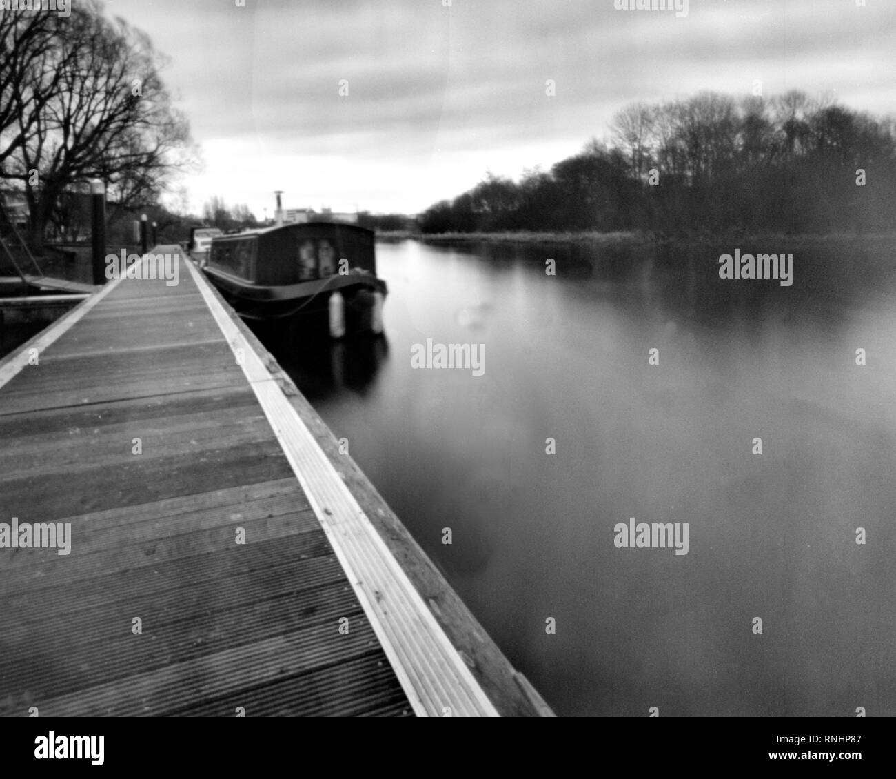 houseboat on the river erne, enniskillen, fermanagh, northern ireland, this black and white photo is NOT sharp due to camera characteristic, taken on  Stock Photo