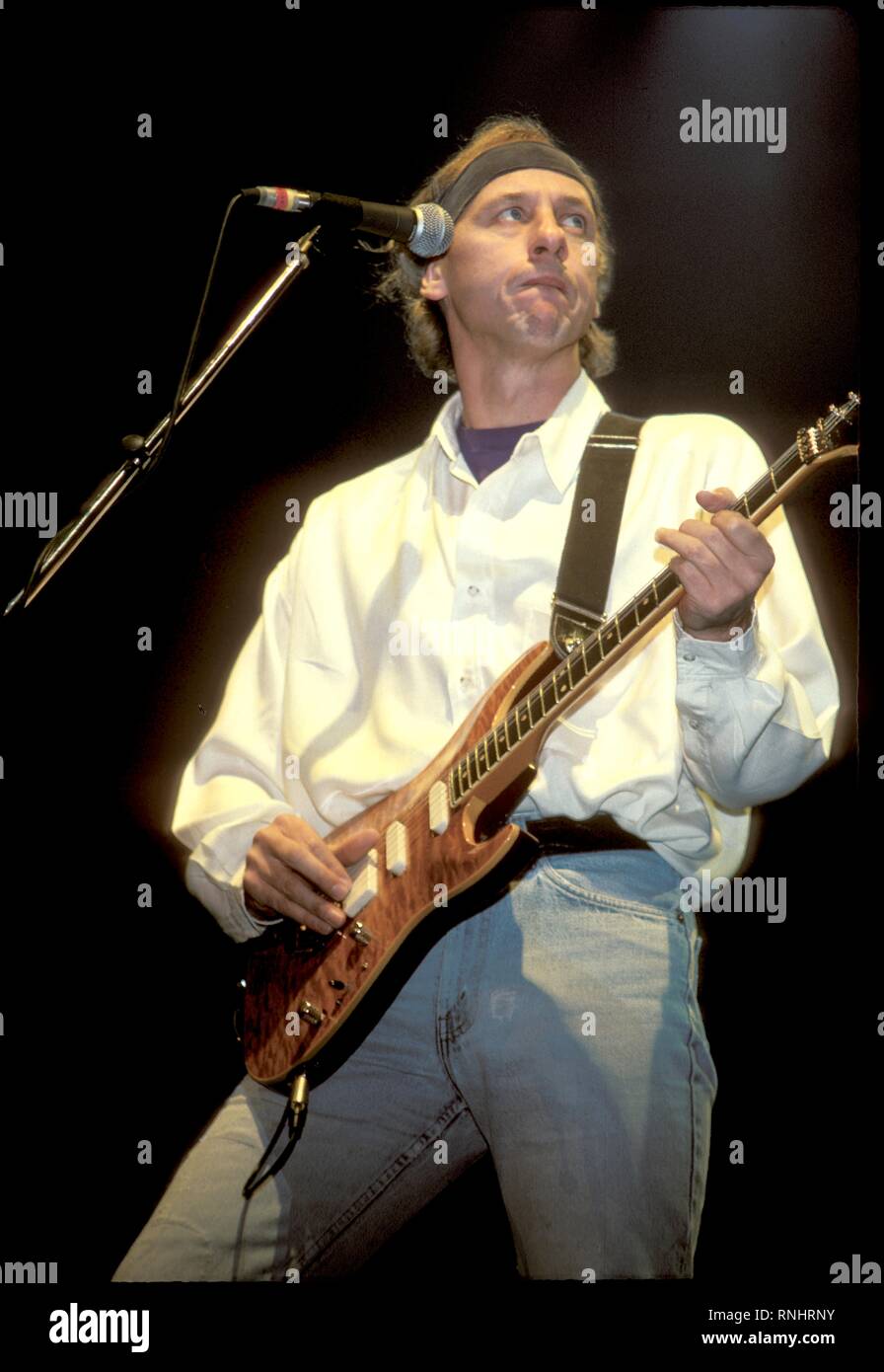 Mark Knopfler of Dire Straits is shown performing on stage during a concert appearance Stock