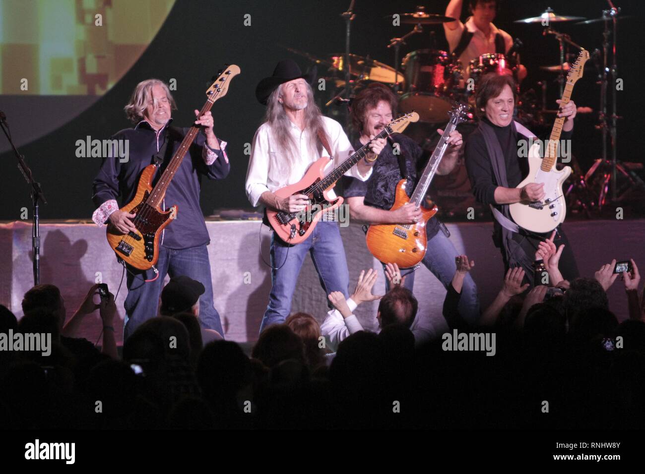 The Doobie Brothers are shown performing on stage during a 'live' concert appearance. Stock Photo
