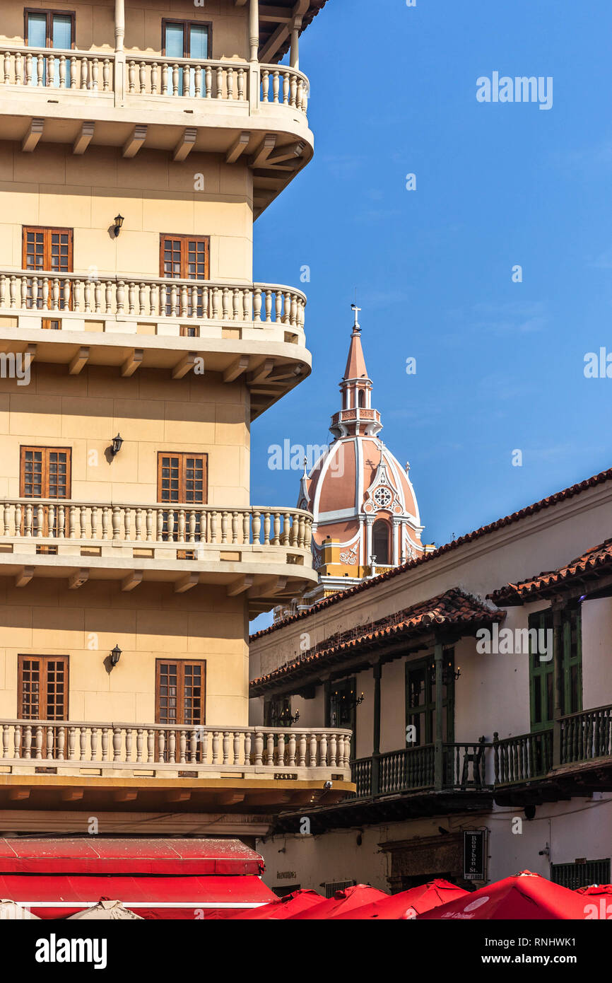 The dome of Cartagena Cathedral seen from Plaza Santo Domingo, behind buildings, Cartagena de Indias, Colombia. Stock Photo