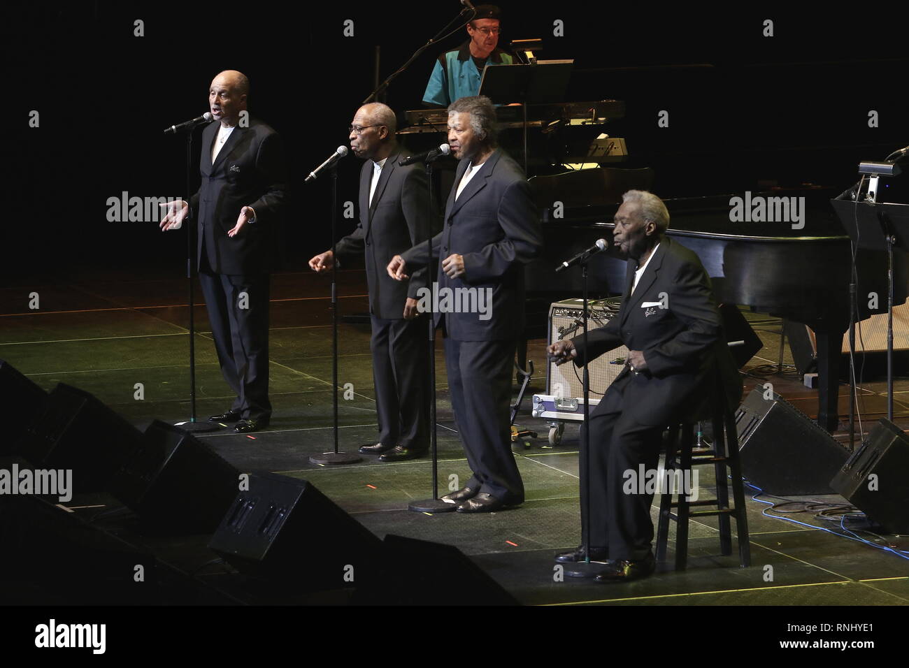 Doo wop vocal group, The Dubbs are shown performing on stage during a 'live' concert appearance. Stock Photo