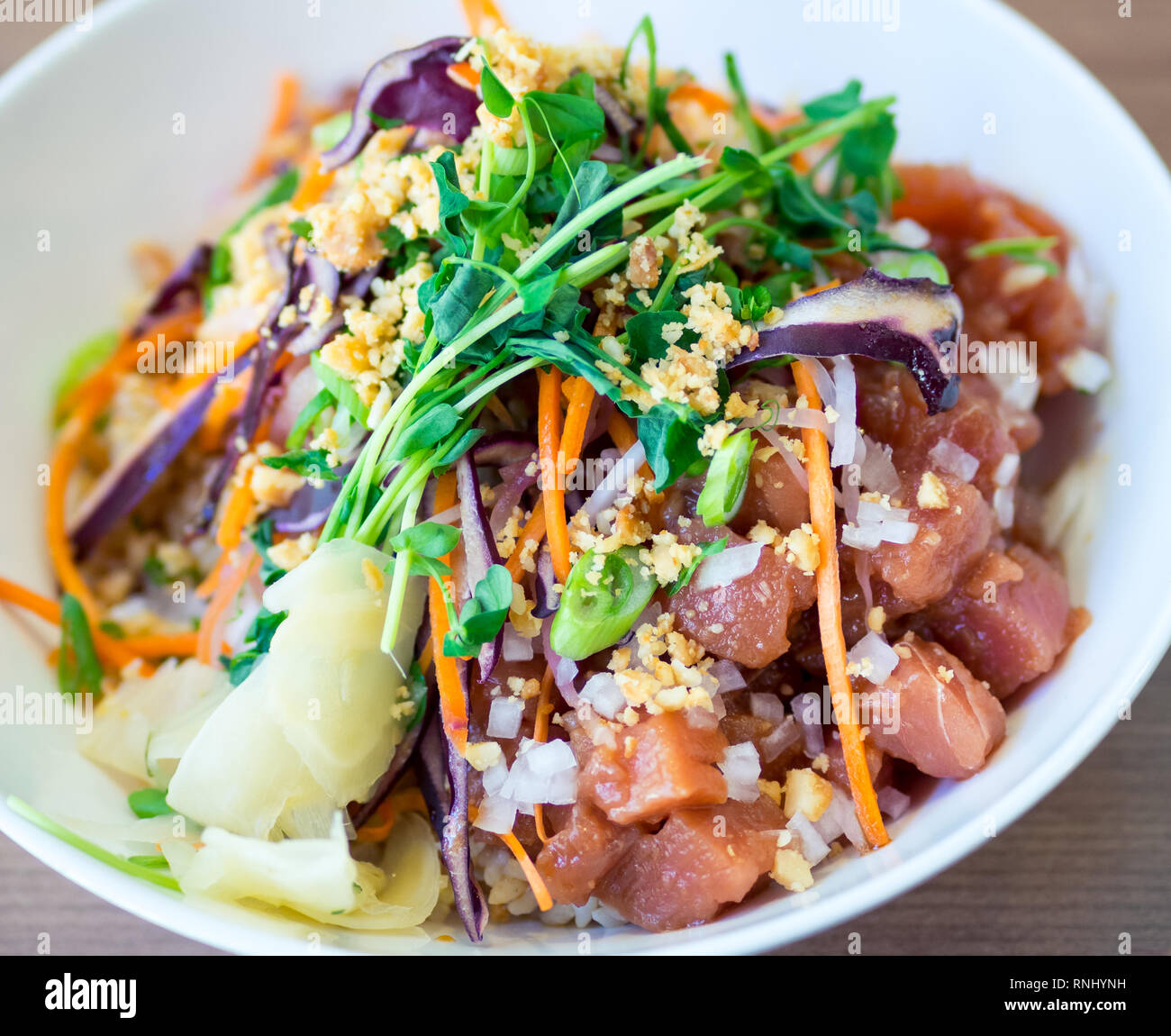 A Hawaiian ahi tuna poke bowl (poke fish salad) from 'Ono Poke Co. in Edmonton, Alberta, Canada. Stock Photo