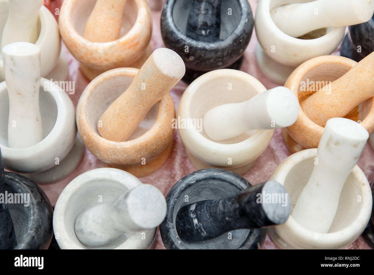 Many mortar and pestle different colors with seasoning Stock Photo Alamy