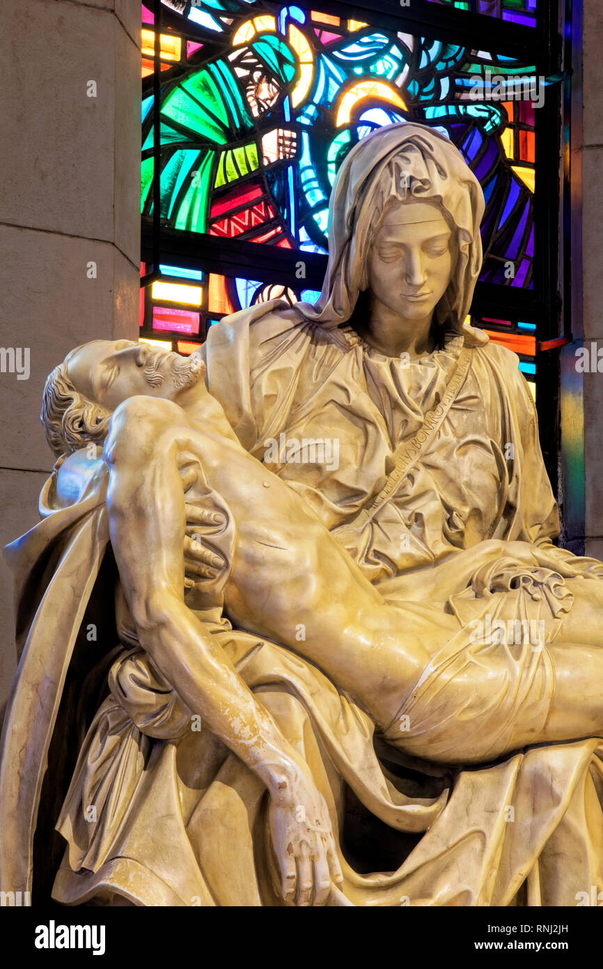 A replica of the famous statue of La Pieta inside the Manila Cathedral, first built in 1571, todays church is the eighth structure with the others des Stock Photo