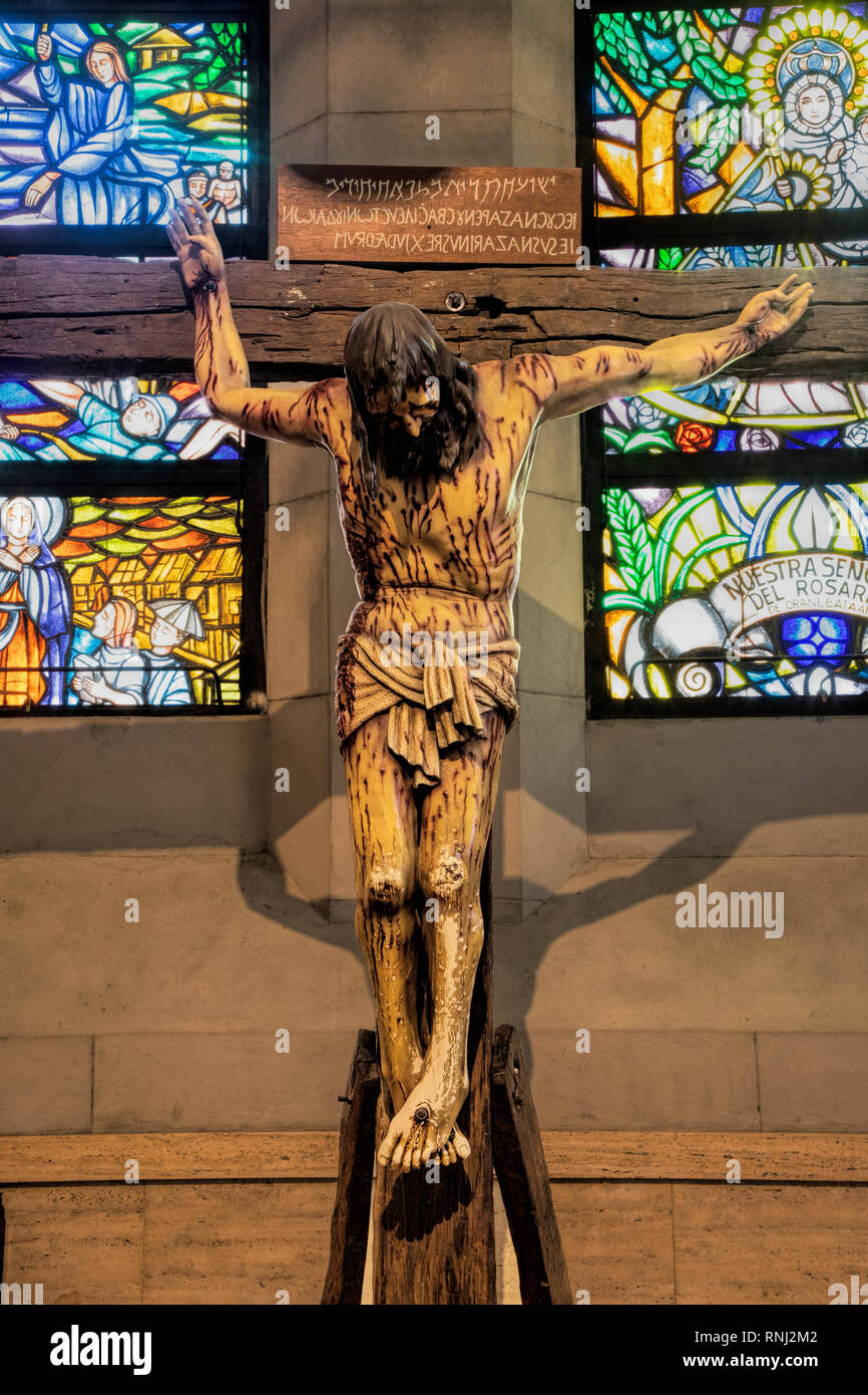 Life size wooden crucifix at the Manila Cathedral, first built in 1571, todays church is the eighth structure with the others destoryed by national de Stock Photo