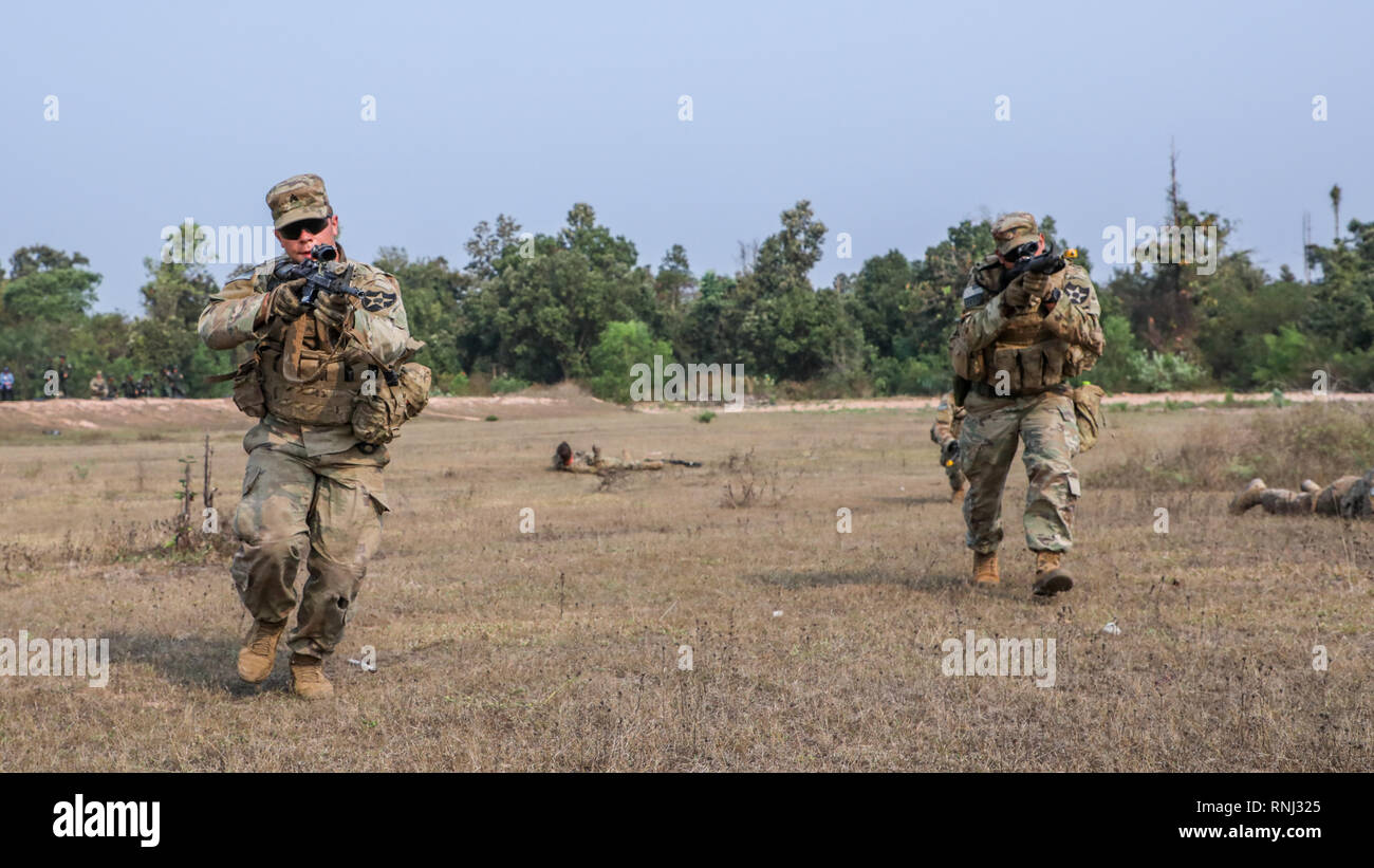 U.S. Soldiers from C Company, 5th Battalion-20th Infantry Regiment demonstrate react to contact battle drill techniques for their Royal Thai Army counterparts as part of the field training exercise for Cobra Gold 2019.  Exercise Cobra Gold increases cooperation, interoperability and collaboration with Thailand and other partner nations in order to achieve effective solutions to common challenges. Stock Photo