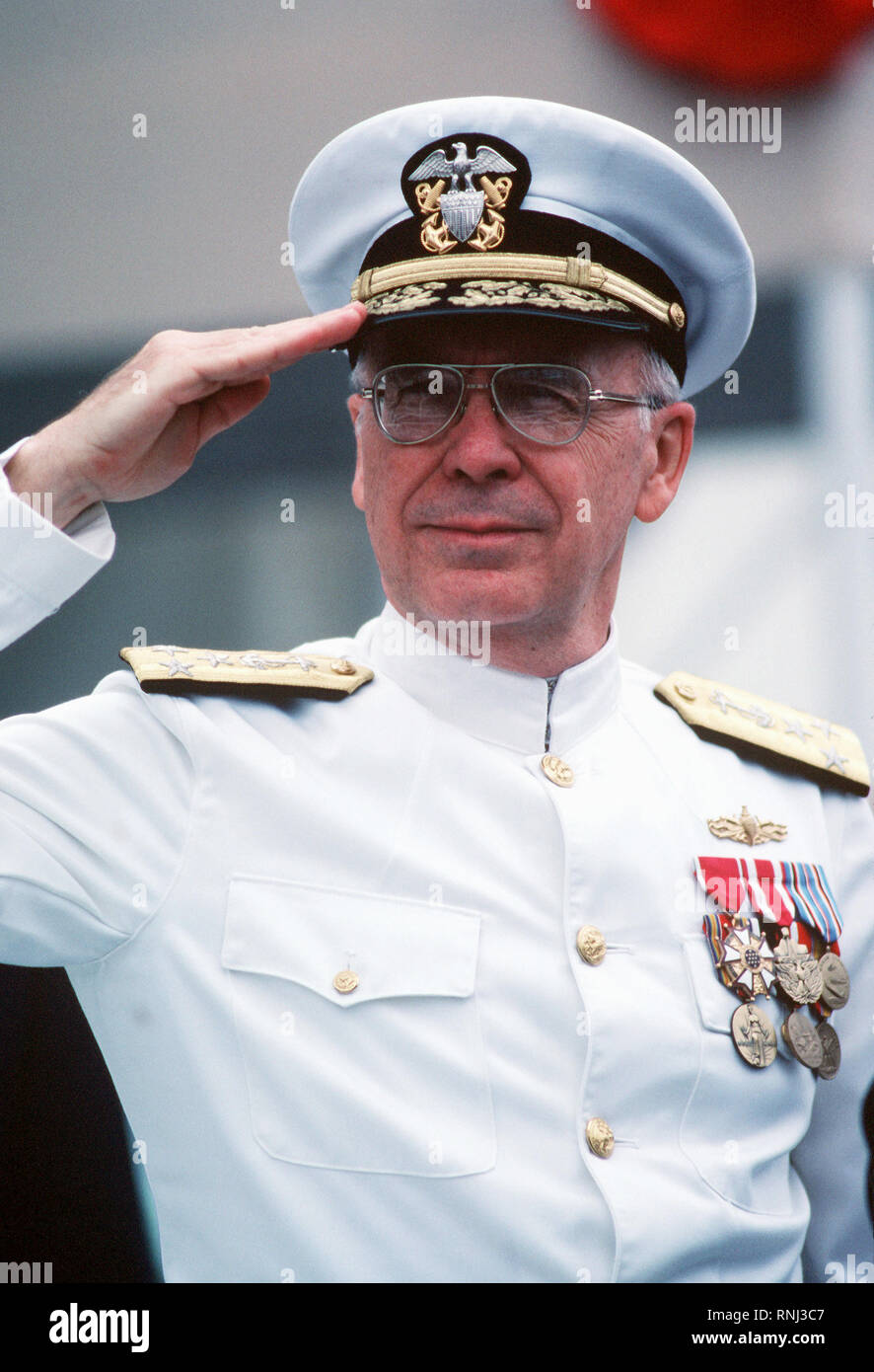 1982 - VADM Robert L. Walters, deputy chief of naval operations, Surface Warfare, salutes during the launching ceremony for the nuclear-powered attack submarine USS BUFFALO (SSN-715). Stock Photo