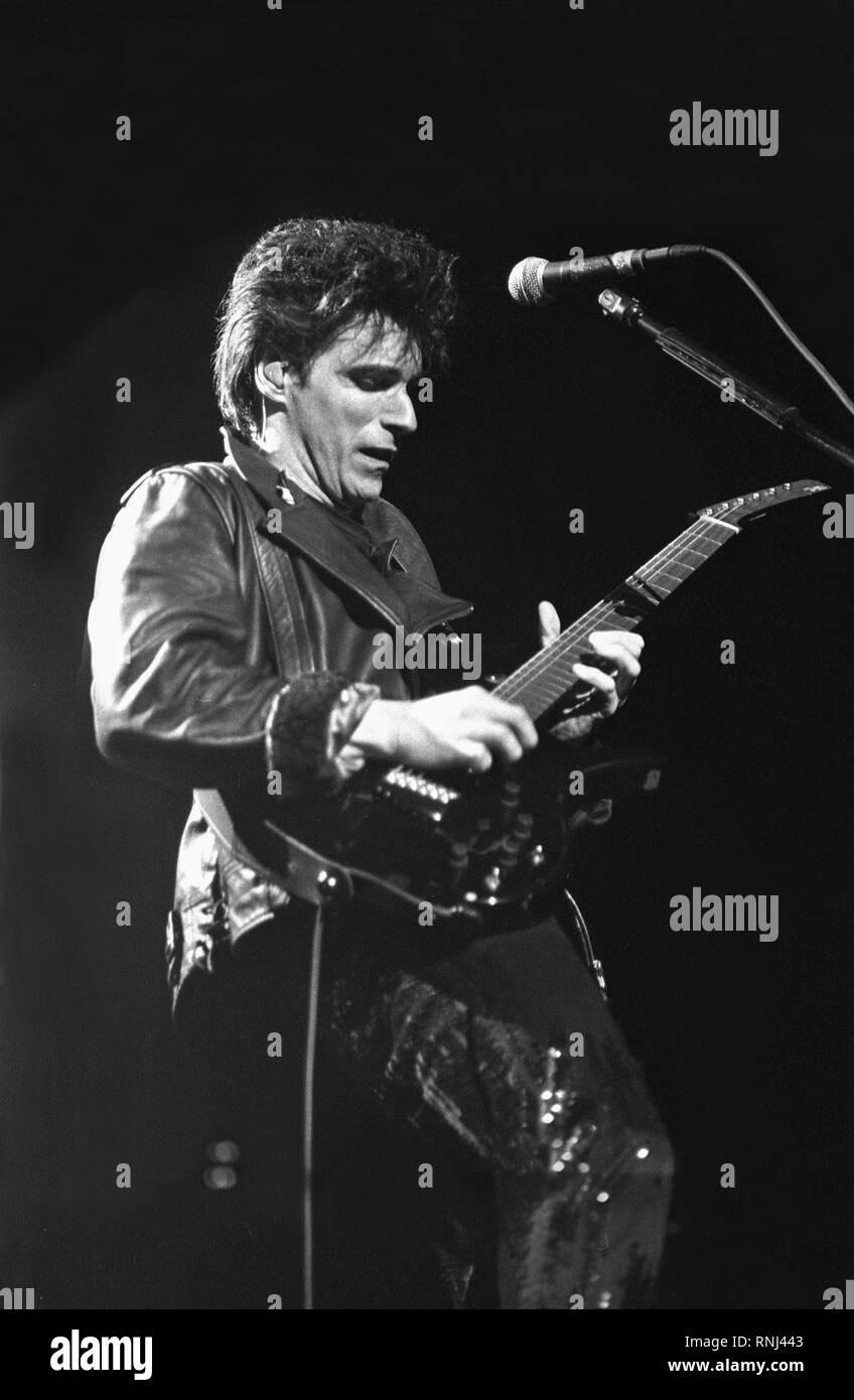 Duran Duran guitarist Warren Cuccurullo is shown performing on stage during a "live" concert appearance Stock Photo
