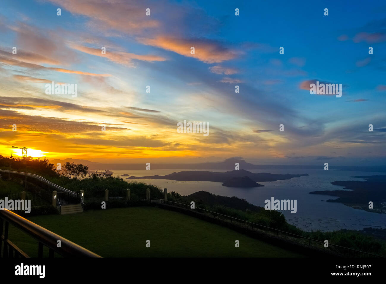 Taal Volcano Island Sunset , With Orange and Blue Sky - Tagaytay, Philippines Stock Photo