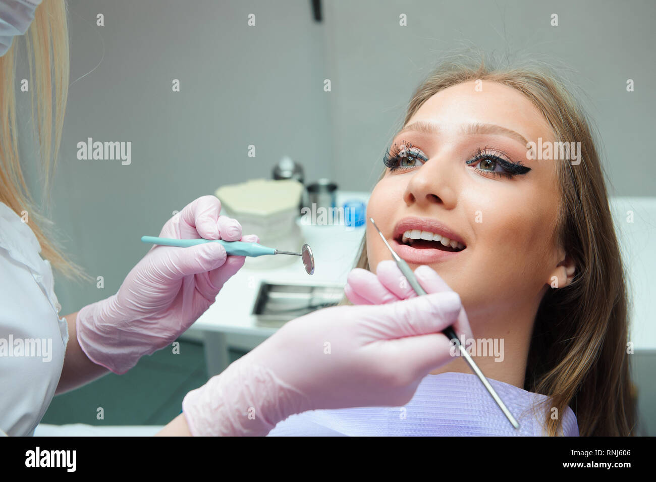 dentistry, patient examination and treatment at the dentist Stock Photo