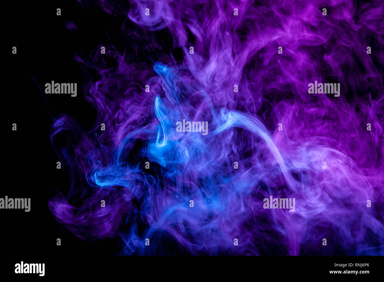 Frozen abstract movement of explosion smoke multiple purple and blue ...