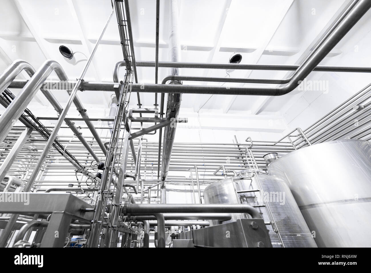 Chrome pipes close-up. Industrial background Stock Photo - Alamy
