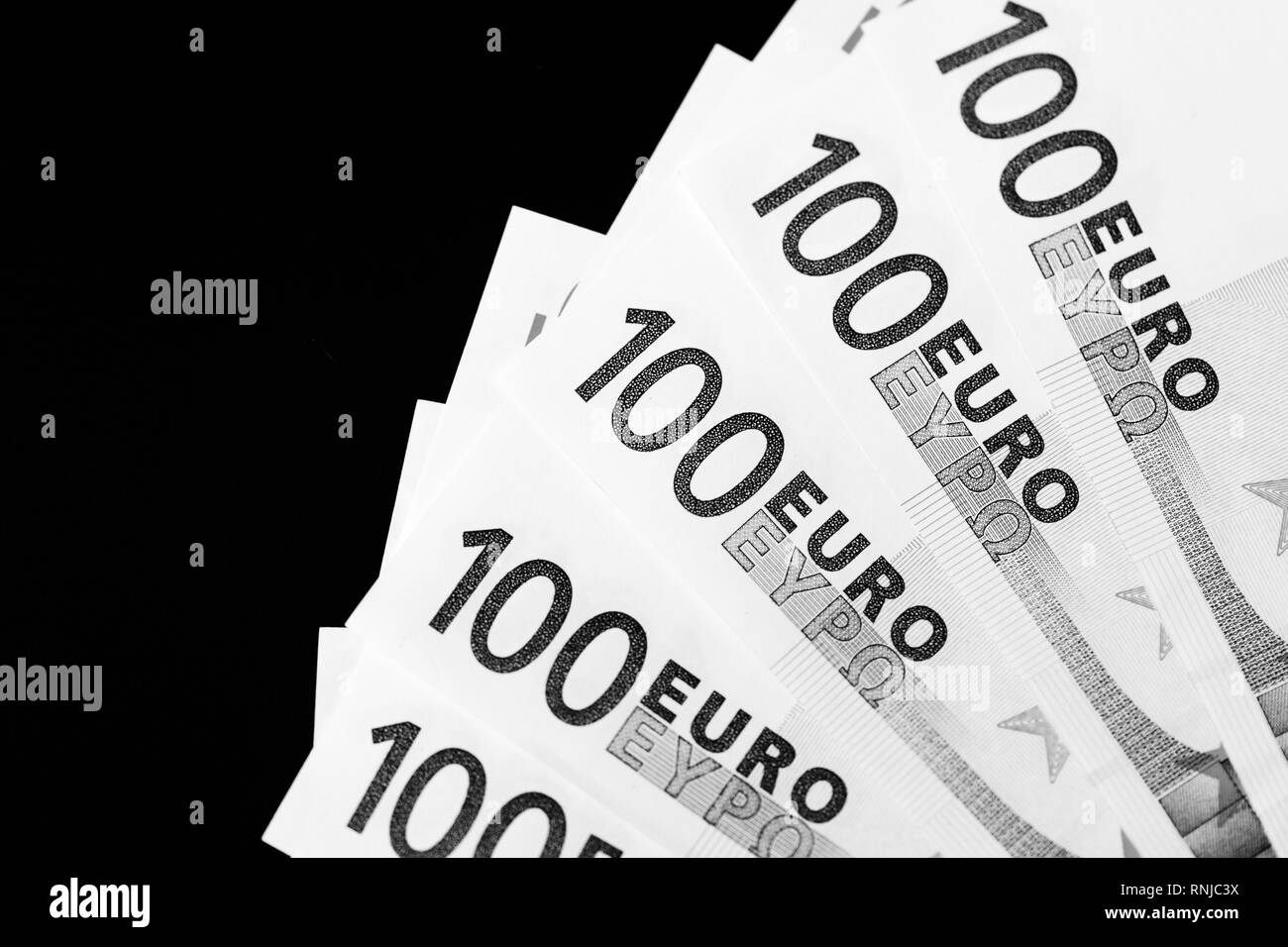 One Hundred euro banknotes as a background close up. Black and white Stock Photo