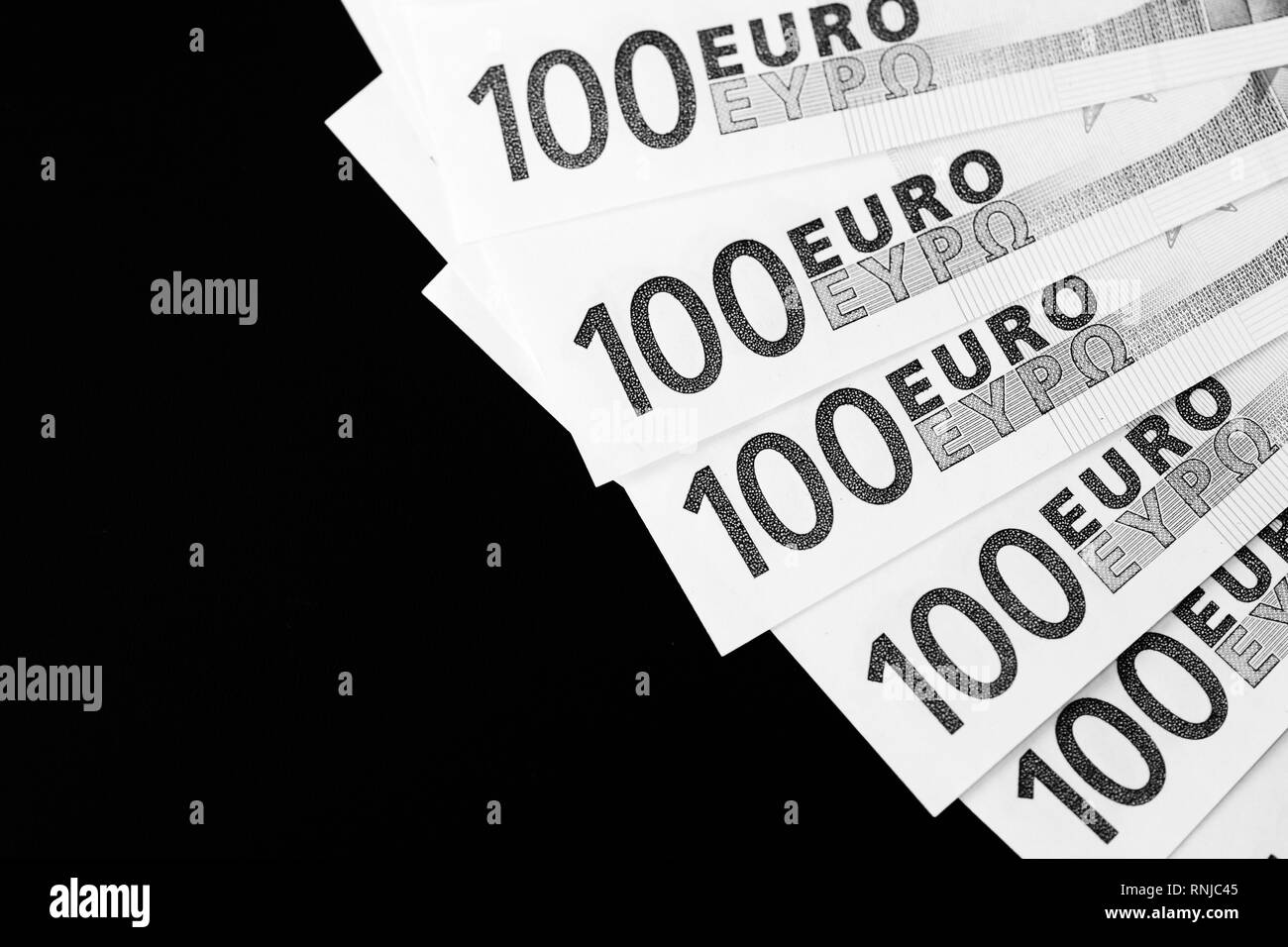 One Hundred euro banknotes as a background close up. Black and white Stock Photo