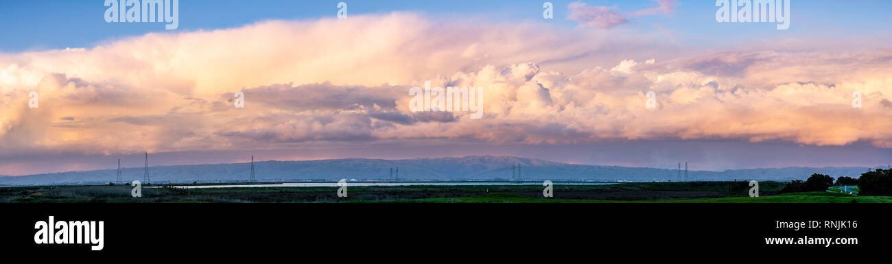 Colorful sunset over the marshes and mountains of south San Francisco bay area, California Stock Photo