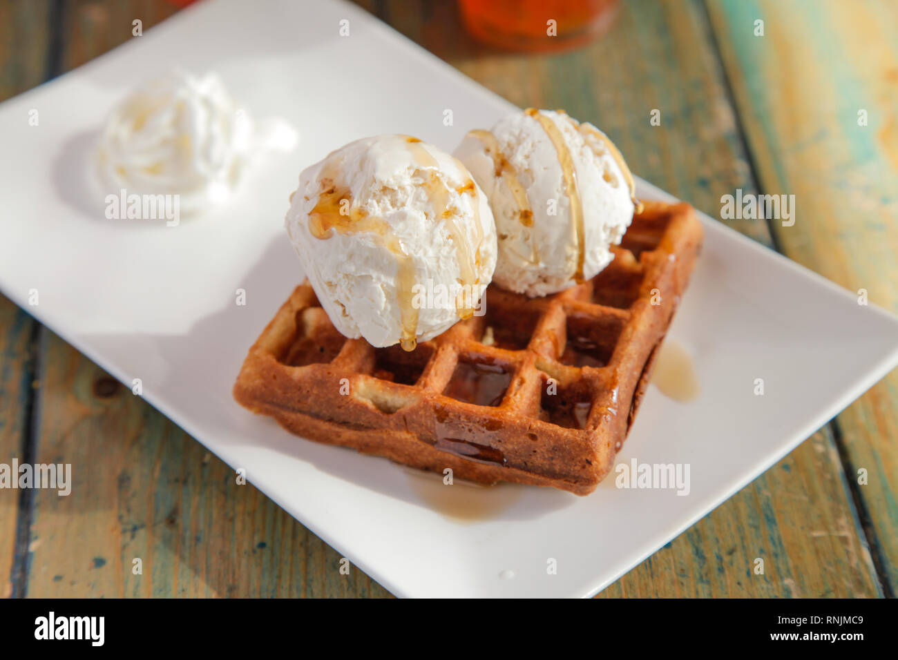 Two scoops of Vanilla caramel ice cream waffle sundae Stock Photo