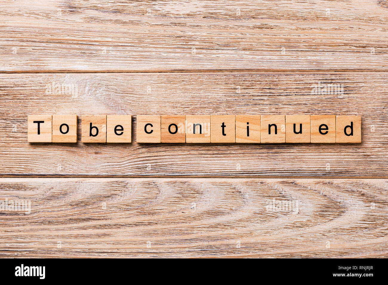 To Be Continued Word Written On Wood Block To Be Continued Text
